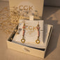 Pendientes colgantes CGK Style con cuentas rosas, detalles en acero inoxidable y dije de corazón en caja de regalo