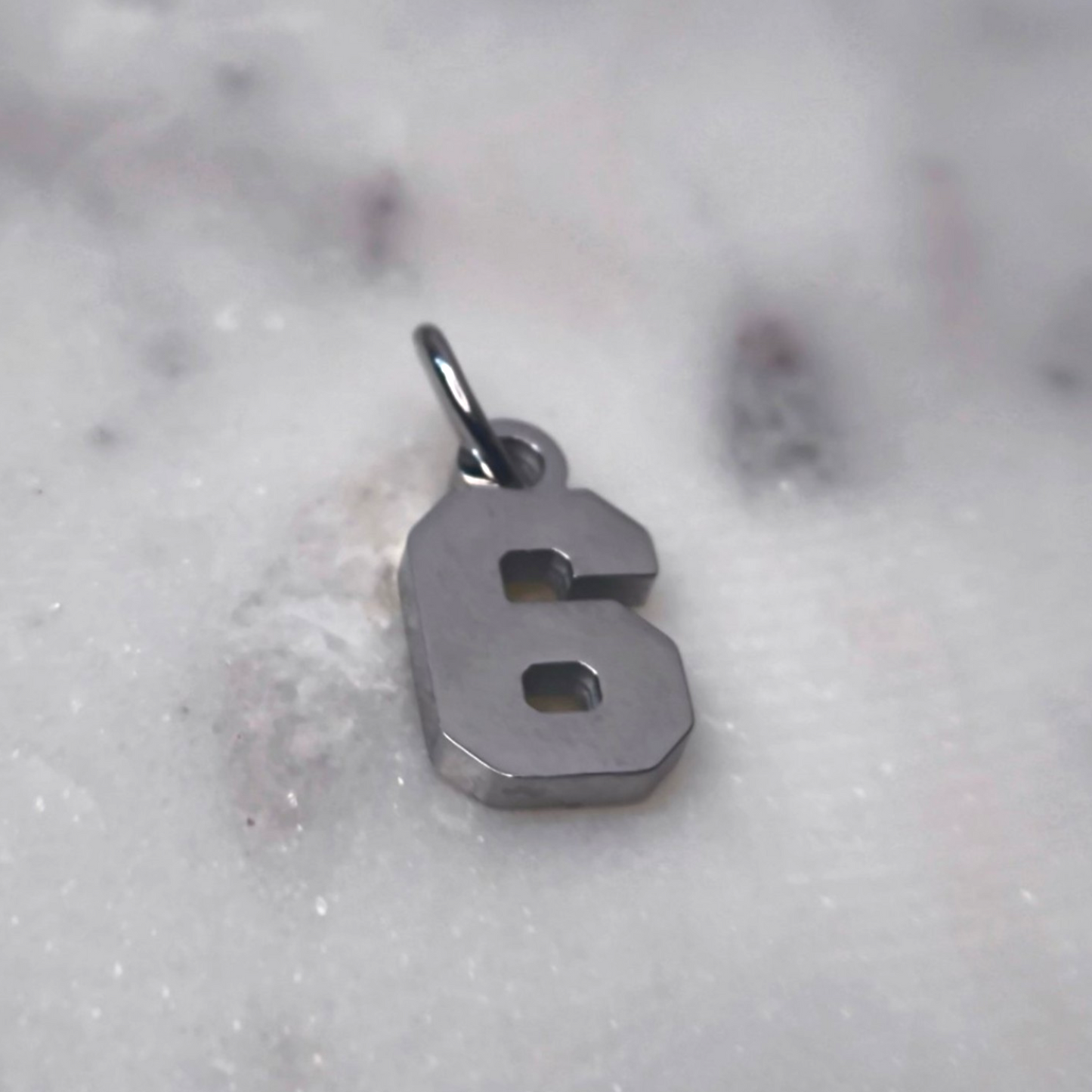 Charm número Plata