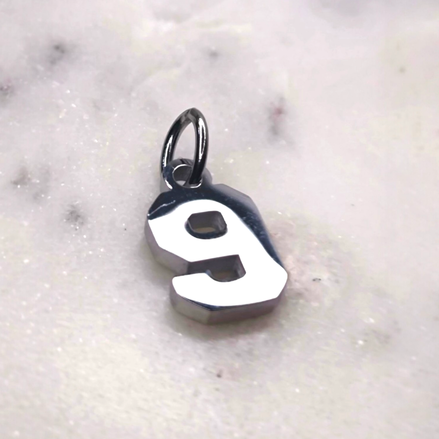 Charm número Plata