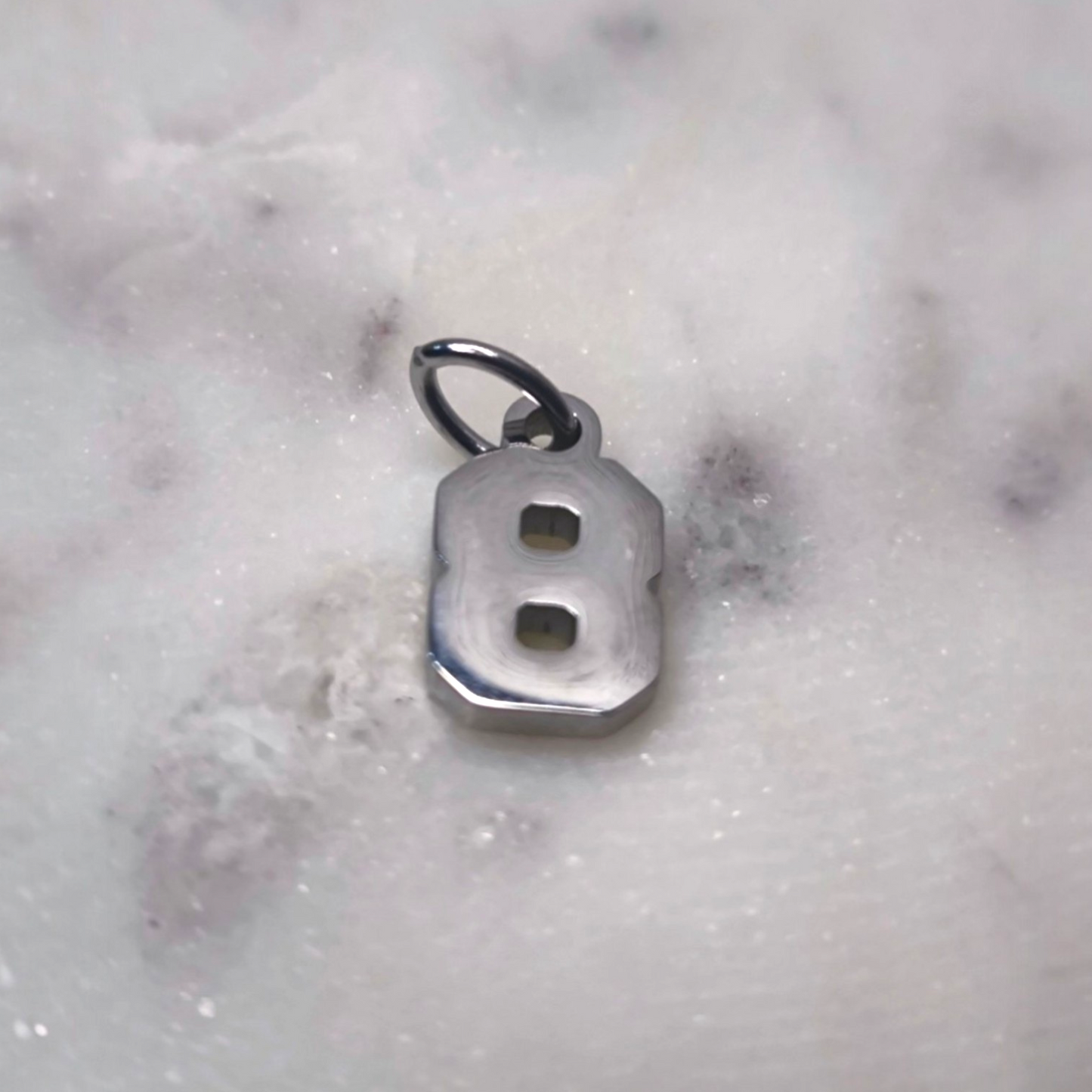 Charm número Plata