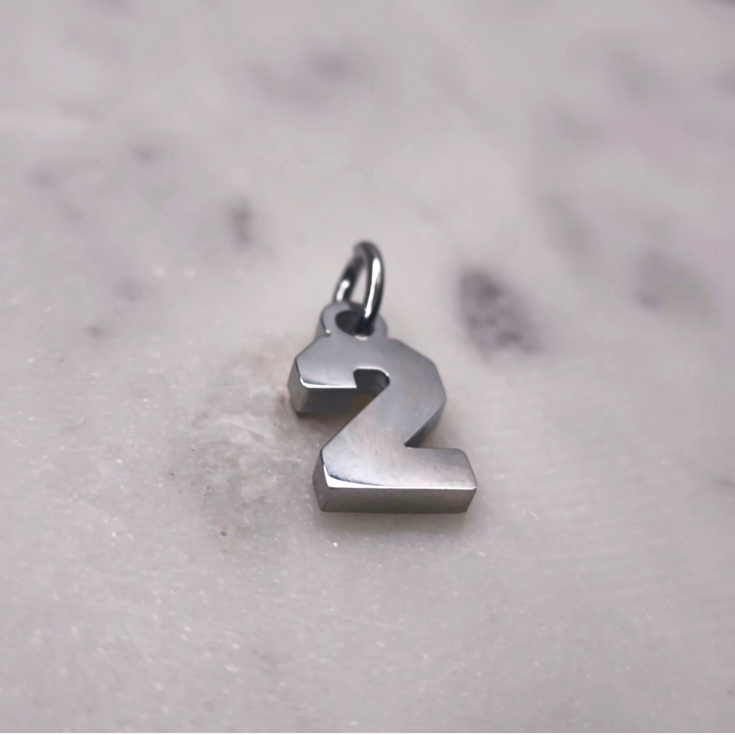 Charm número Plata