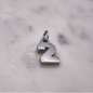 Charm número Plata